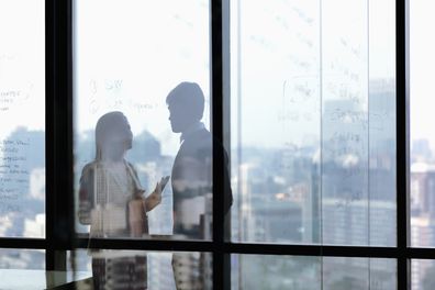 Man and woman arguing at work