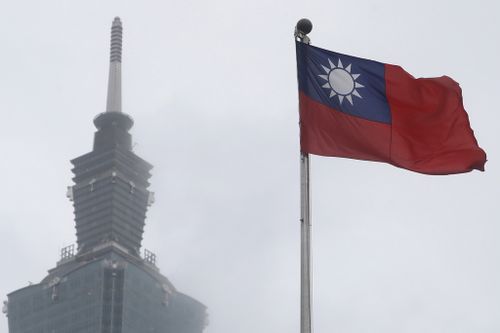 FILE - A Taiwan national flag flutters near the Taipei 101 building at the National Dr. Sun Yat-Sen Memorial Hall in Taipei, Taiwan, May 7, 2023. (AP Photo/Chiang Ying-ying, File)