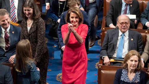 House Democratic Leader Nancy Pelosi of California enters the chamber as the House of Representatives assembles for the first day of the 116th Congress.