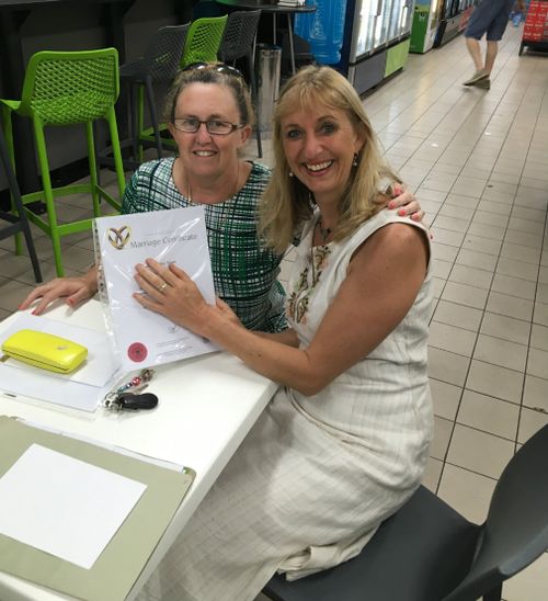 Celebrant Kari and the representative from Births, Deaths and Marriages Queensland at a Forest Glen roadhouse. (Source: Kari Celebrations)