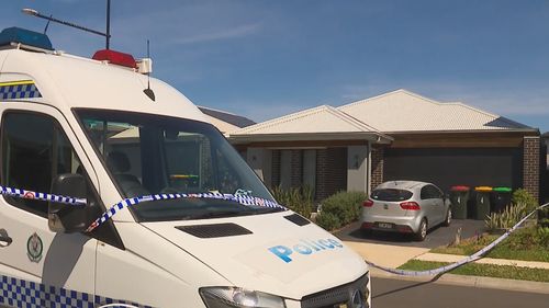 A police car out the front of a home in Melonba following the arrest of a woman. 