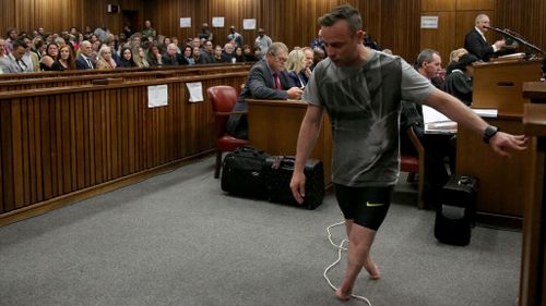 People gasp as Oscar Pistorius walks unsteadily through the courtroom. (AAP)
