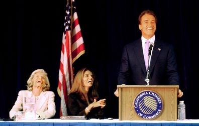 Californa Governor-Elect Arnold Schwarzenegger (right) is joined by his wife, Maria Shriver (center) and her mother, Eunice Kennedy Shriver (left), as he jokes about Democrats during a meeting of his transition committee in Sacramento, California, on the eve of his inauguration, Sunday, November 16, 2003. 