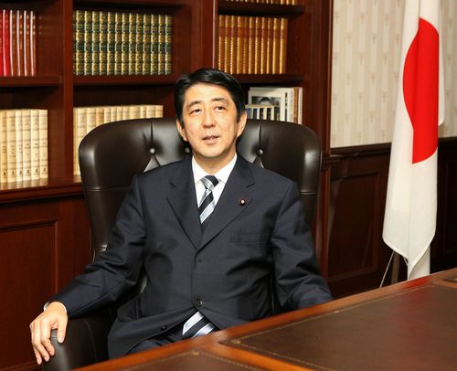 Newly elected head of the Liberal Democratic Party Shinzo Abe smiles as he sits in the presidential seat at the party headquarters in Tokyo on Wednesday, September 20, 2006. 