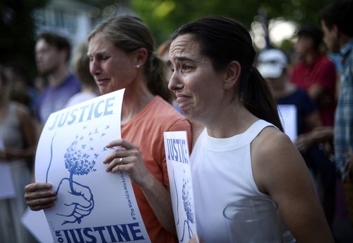 Friend Betsy Custis, and others attend a march in honour of Justine in Minneapolis on July 20. Picture: AAP