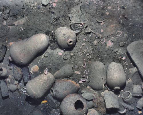 The wreck was partially sediment-covered, but with the camera images from the lower altitude REMUS missions, the crew was able to see new details, such as ceramics and other artifacts. (REMUS image, Woods Hole Oceanographic Institution)