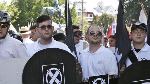 James Alex Fields Jr, second from left, holds a black shield in Charlottesville, where a white supremacist rally took place. 