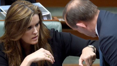 Ms Credlin and Tony Abbott speaking in parliament when Mr Abbott was prime minister.