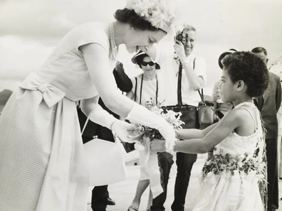 The Queen receiving a bouquet of flowers from Fijian Princess, Adi Kaunilotuma, during a visit to the country in 1963.