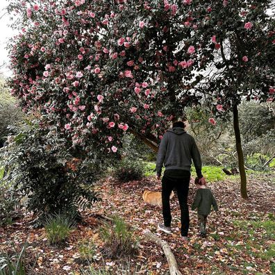 Princess Eugenie's husband Jack Brooksbank and son August hiking in a garden