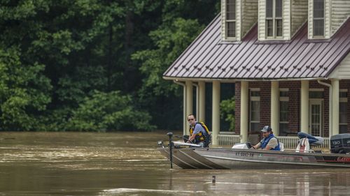 Homes are flooded by Lost Creek, Ky., on Thursday, July 28, 2022.  Heavy rains have caused flash flooding and mudslides as storms pound parts of central Appalachia. Kentucky Gov. Andy Beshear says it's some of the worst flooding in state history.  (Ryan C. Hermens/Lexington Herald-Leader via AP)