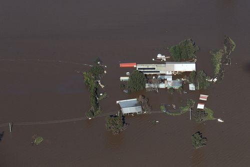 NSW Premier Dominic Perrottet surveys the floods in the Hunter Region in a chopper this morning with Minister for Emergency Services and Resilience and Minister for Flood Recovery Steph Cooke. Pictured is flooding in and around Maitland. Picture: David Swift