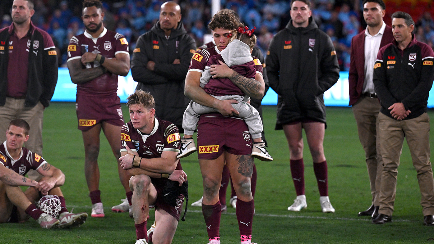 Reece Walsh looks dejected as he holds his daughter following the Maroons&#x27; loss in game three.