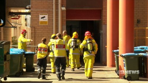Eight fire crews entered the hospital wearing protective gear. (9NEWS)