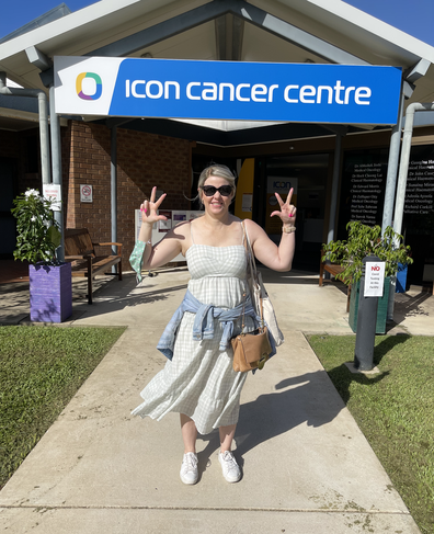Becky Sinclair poses outside the Icon Cancer Centre in Townsville.