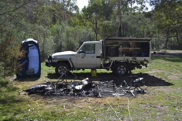 Tendered photos of Russell Hill and Carol Clay&#x27;s burnt-out campsite were shown to the jury.