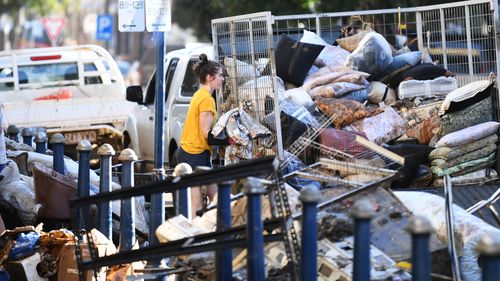 LISMORE, AUSTRALIA - MARCH 02: Piles of destroyed goods line the flood affected city centre on March 02, 2022 in Lismore, Australia. Several northern New South Wales towns have been forced to evacuate as Australia faces unprecedented storms and the worst flooding in a decade. (Photo by Dan Peled/Getty Images)