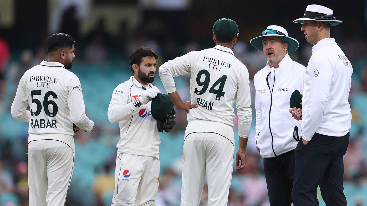 Shan Masood of Pakistan speaks with the umpires as play is suspended due to bad light during day two of the Men&#x27;s Third Test Match in the series between Australia and Pakistan at Sydney Cricket Ground on January 04, 2024 in Sydney, Australia. (Photo by Jason McCawley - CA/Cricket Australia via Getty Images)
