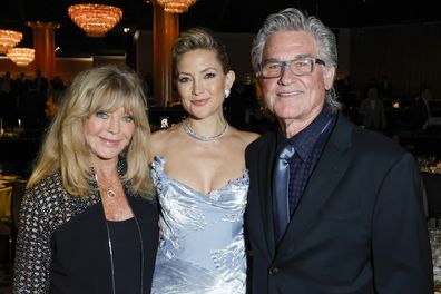 BEVERLY HILLS, CALIFORNIA - OCTOBER 08: (L-R) Goldie Hawn, Kate Hudson and Kurt Russell attend Will Rogers Motion Picture Pioneers Foundation's Pioneer Dinner honoring Kate Hudson at The Beverly Hilton on October 08, 2025 in Beverly Hills, California.  (Photo by Frazer Harrison/Getty Images)