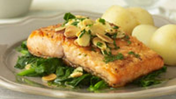 Trout with almonds and steamed spinach