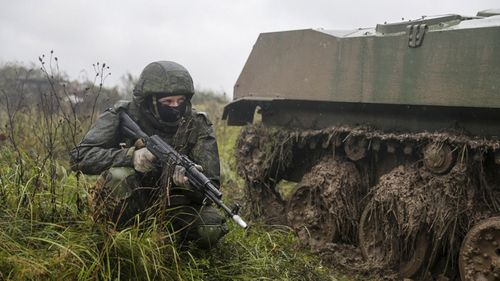 A Russian soldier takes cover during last year's war games.
