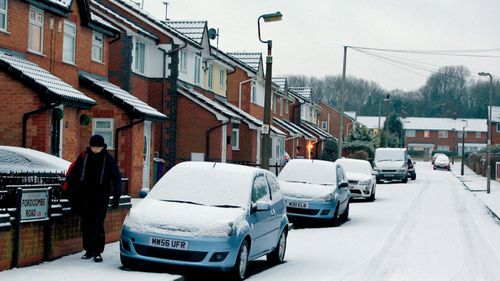 Residents in Liverpool, north-west England, wake up to a snowy morning. (AP).