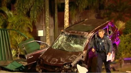 Woman hospitalised after smashing into parked cars on the Gold Coast