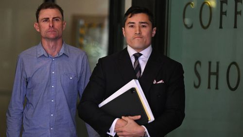 Daniel Muston (left) leaves Downing Centre Local Court in Sydney
