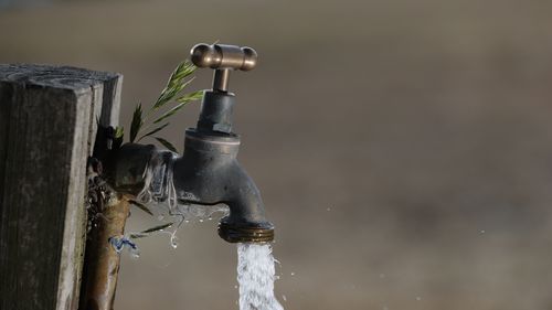 A tap with water coming out of it.