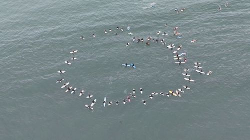 The paddle out was a fitting tribute for the men, who spent their final days in Mexico surfing.