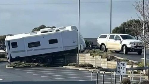 This driver wasn't a happy camper, after getting his caravan became stuck in a shopping centre car park in Adelaide.