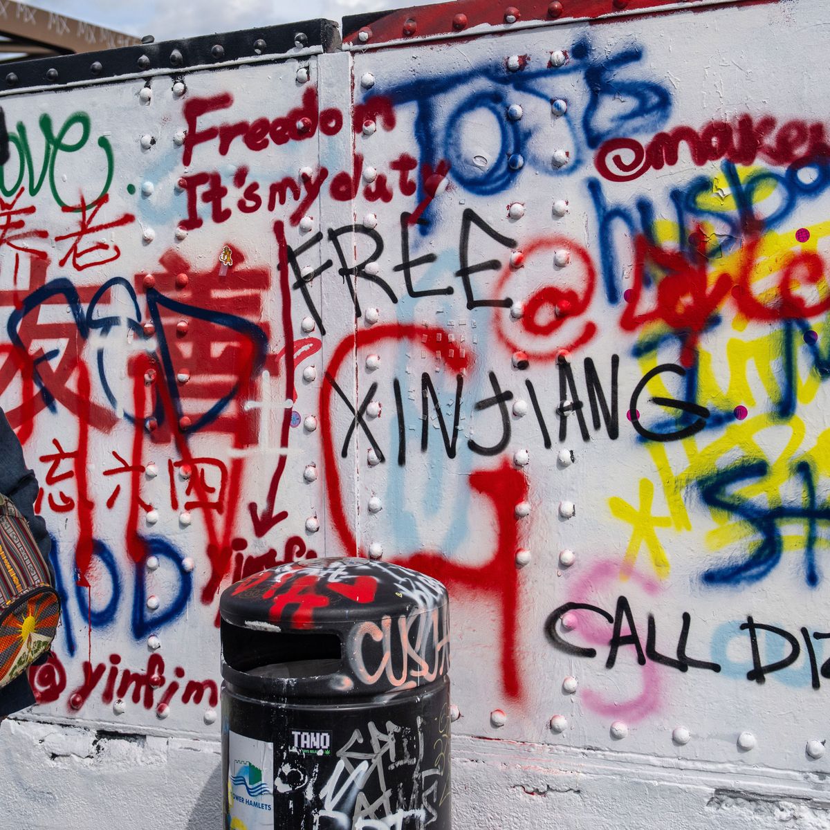 Chinese Communist Party slogans spark graffiti war on London's