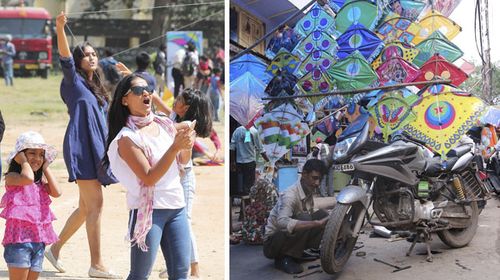 Women fly kites and, right, a street seller shows off his range of colourful wares. (AAP)