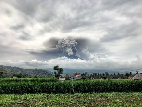 Mount Agung spews ash into the sky on the first day of the volcanic eruption in Bali, Indonesia on November 27, 2017. (AAP)