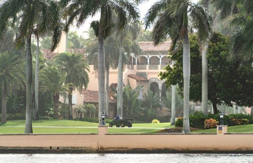A groundskeeper works on the property owned by Donald Trump, called Mar-a-Lago.
