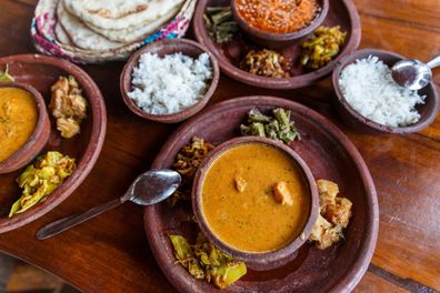 close up view of traditional asian food on wooden tabletop, sri lanka