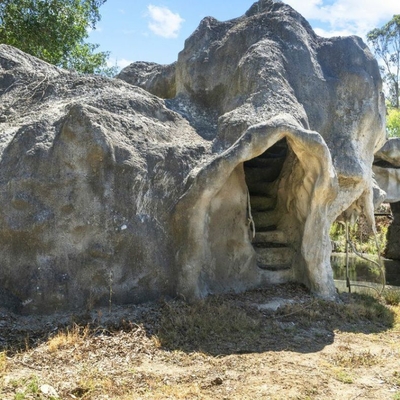 Romantic and mysterious home with cave and moon bridge 20 years in the making