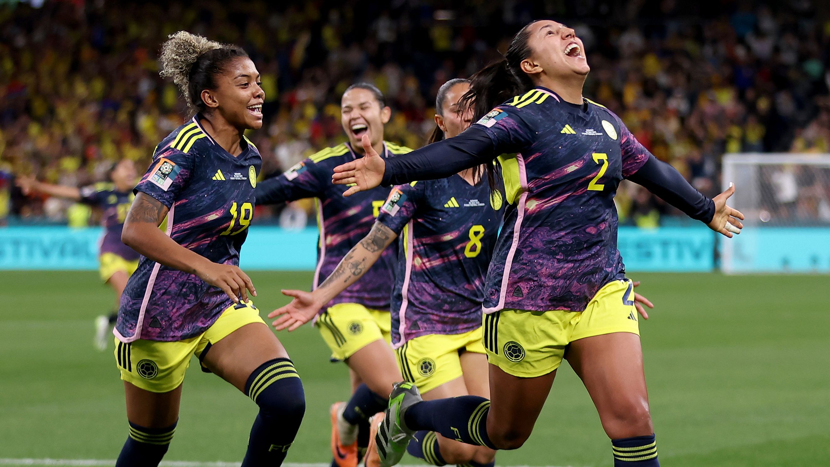Manuela Vanegas of Colombia celebrates with teammates after scoring her team&#x27;s second goal.