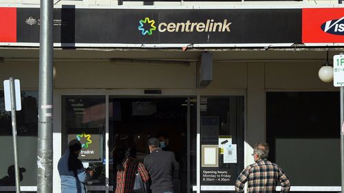 People queue outside Centrelink.