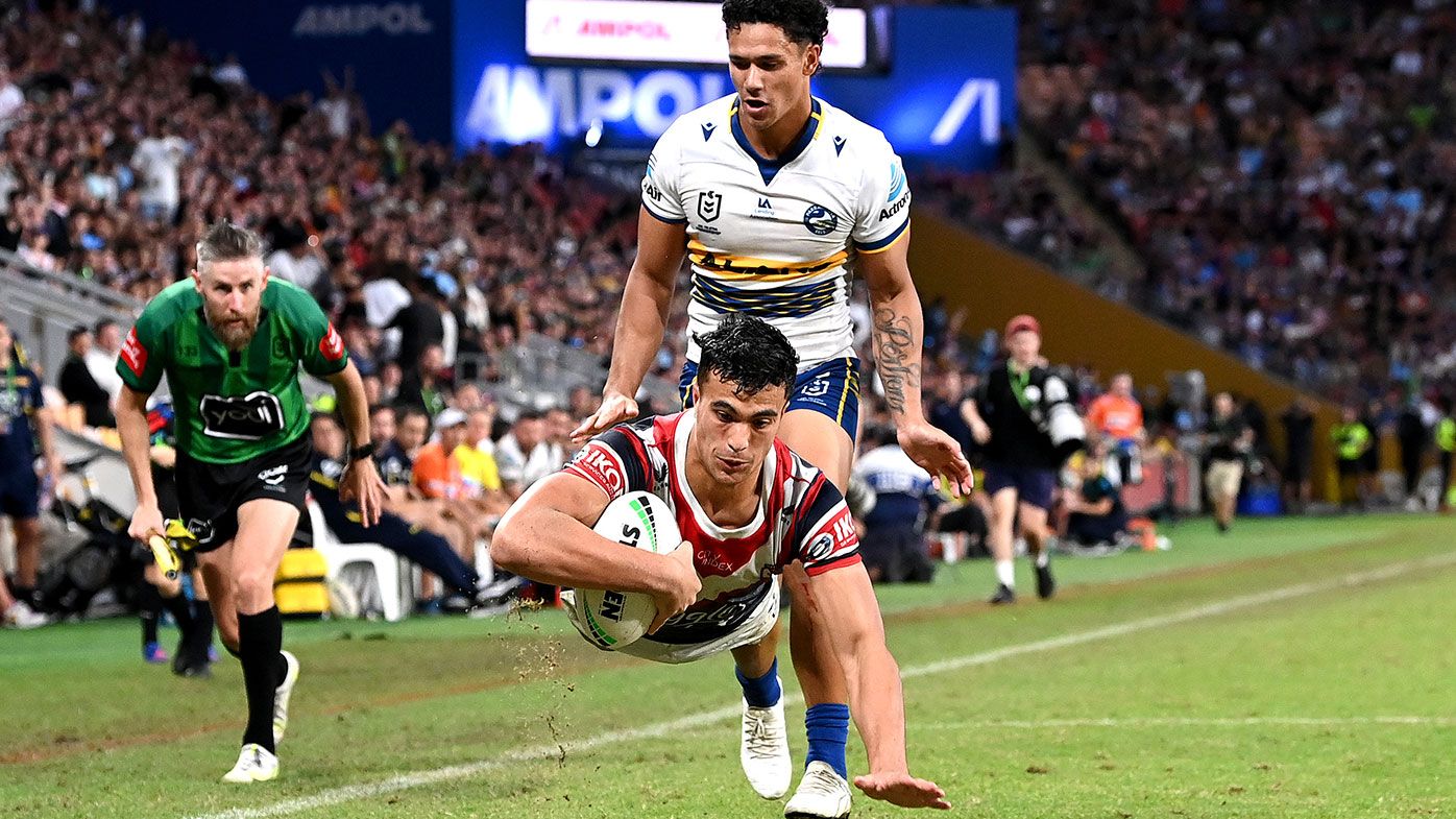 Joseph Suaalii of the Roosters goes in for a try