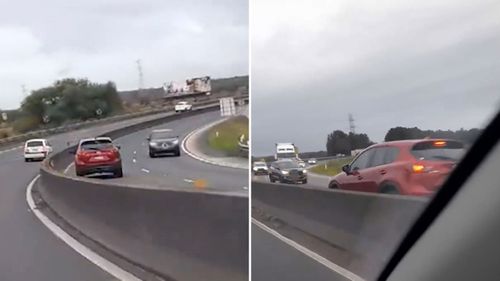 The red Mazda was going the wrong way down the highway at speed.