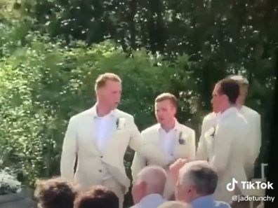 The heroic best man prevents Tuncdoruk's boyfriend from blocking the view of the kiss.