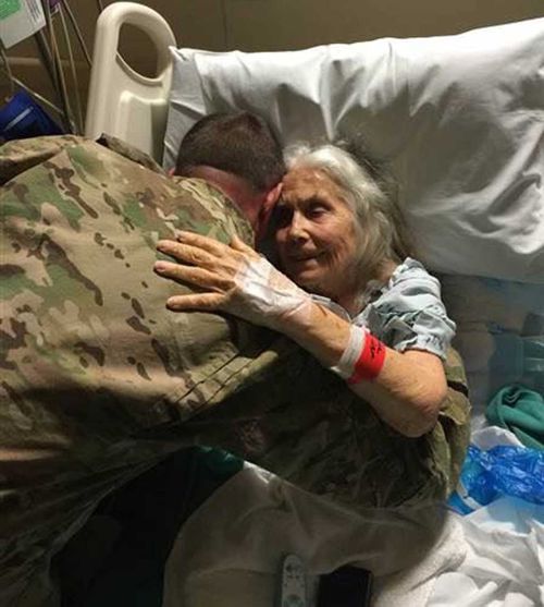 Elizabeth Laird shares a hug with a soldier. (Image: TODAY US)
