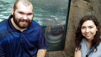 Fiona the Hippo happily photo bombed the couple's special moment.