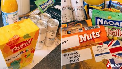 Woman packs funny care package for husband with stickers on food products.