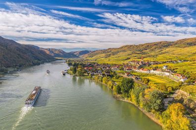 Ships make their way along the Danube River near Weissenkirchen in Austria. European river cruises are a great value right after Thanksgiving into the first two weeks of December, one travel expert says.Mandatory Credit:	extravagantni/iStockphoto/Getty Images via CNN Newsource