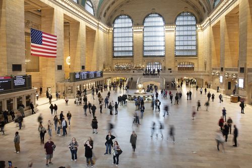 Commuters pass through a quiet Grand Central Terminal, Tuesday, March 10, 2020 in New York. 