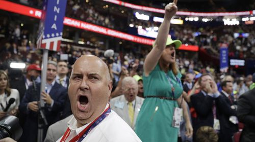 Delegates in uproar on the floor of the GOP convention in Cleveland. (AAP)