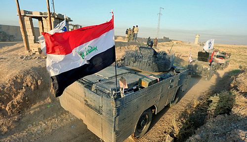 Iraqi military vehicles enter Kirkuk. (Photo: EPA).