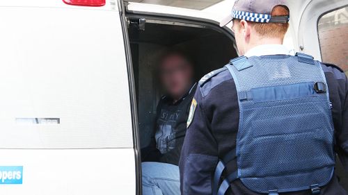 The men were arrested in Victoria and extradited to NSW where they were taken to Mascot Police Station. (NSW Police)